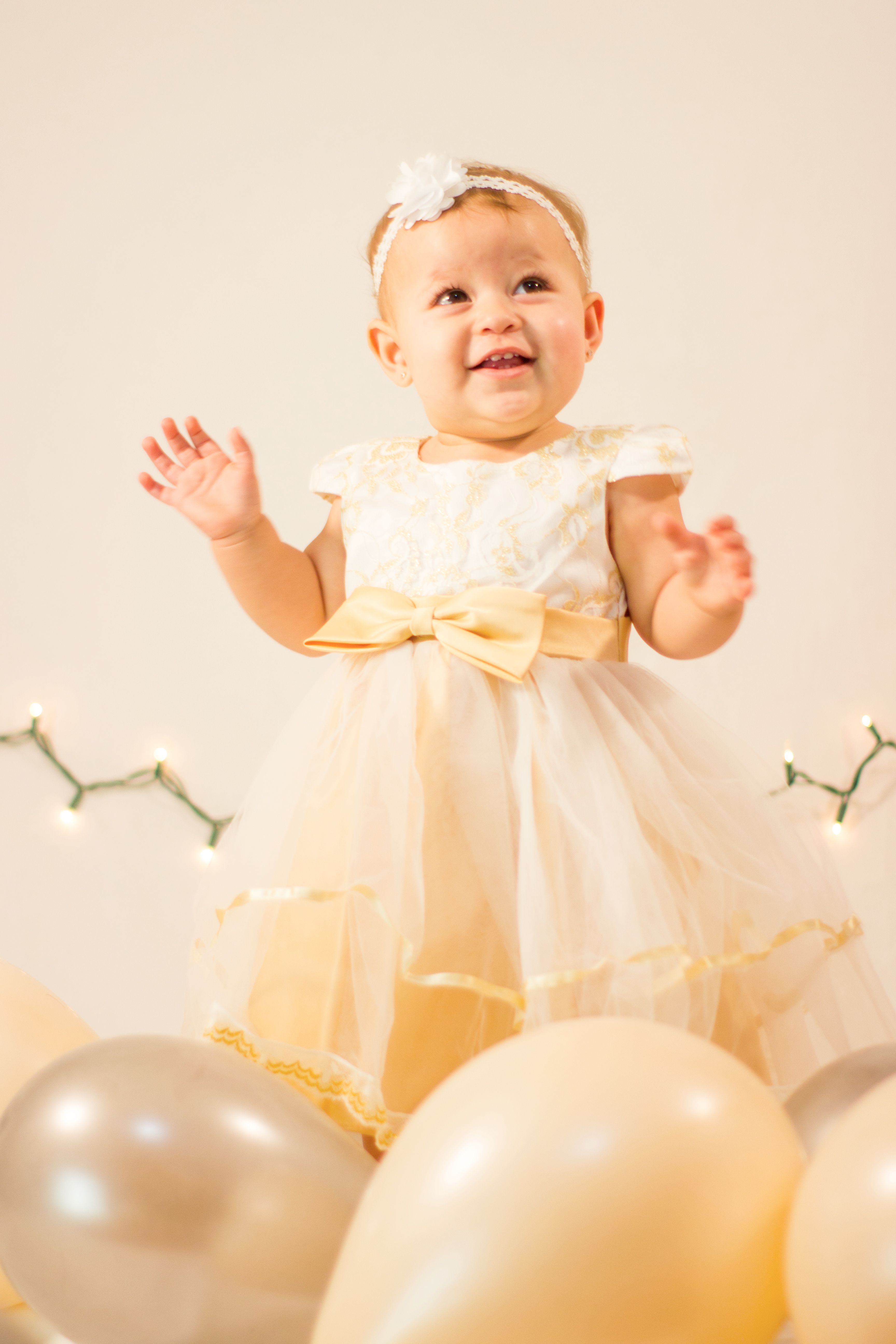 Girl in Creamy Dress among Balloons  Free Stock Photo