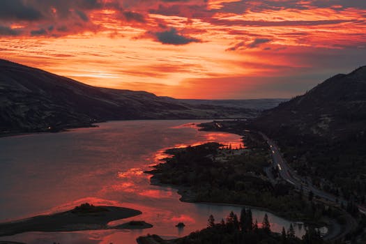 A breathtaking aerial view of the Columbia River Gorge during a vibrant sunset.