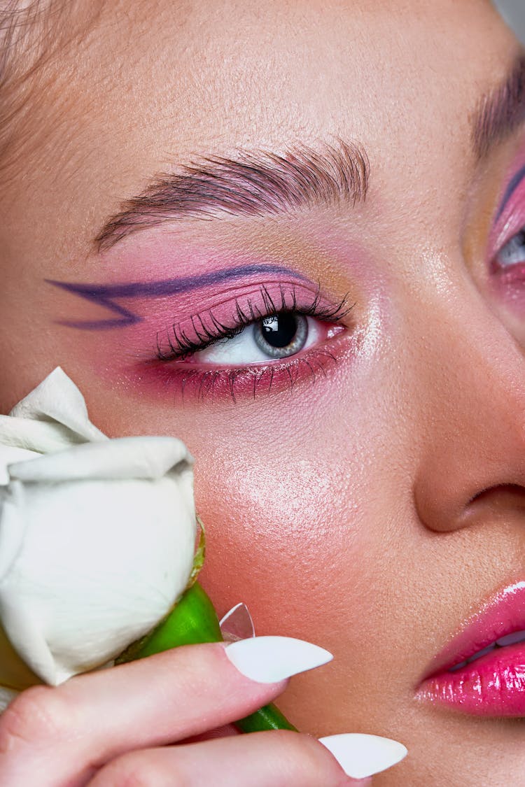 Close-up Of Woman Wearing Creative Makeup 