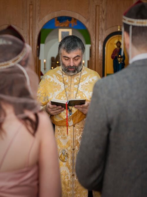 Georgian orthodox priest during wedding ceremony in church in Georgia