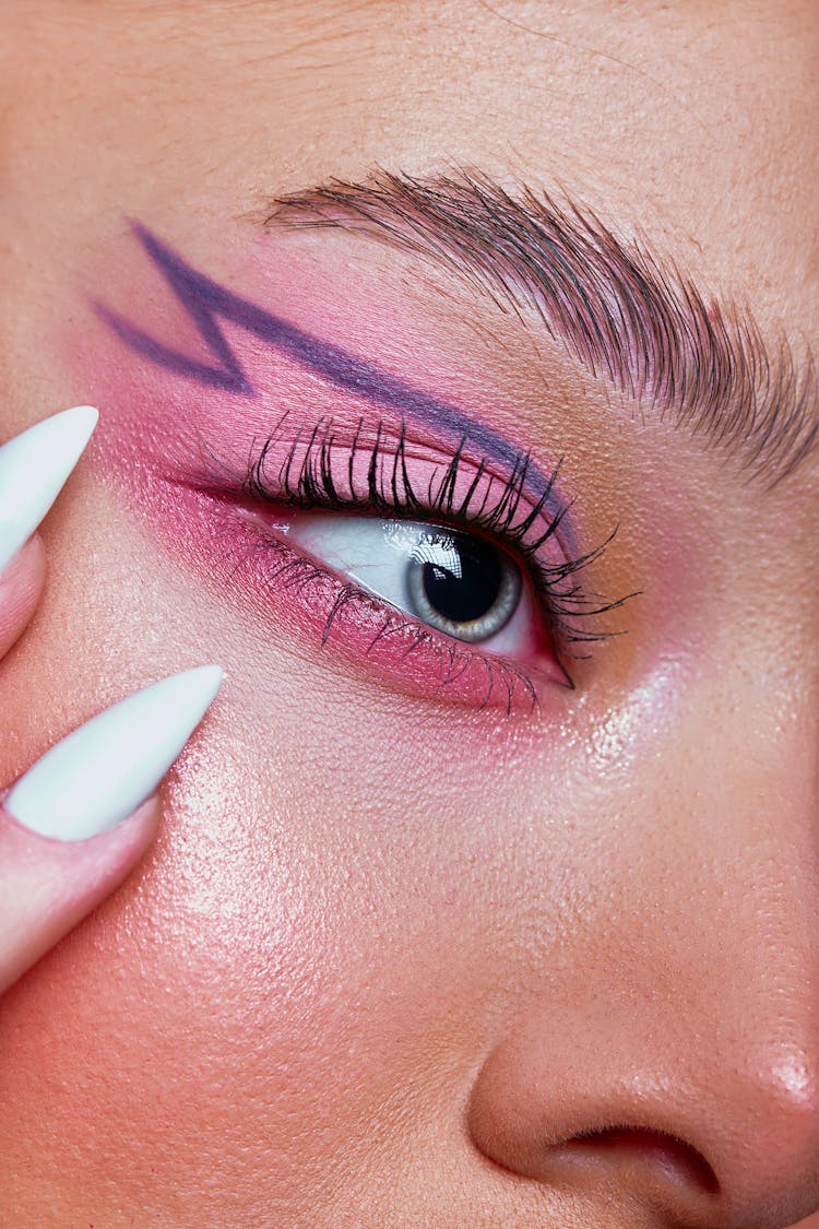 Close-up Of Woman Wearing Creative Makeup 