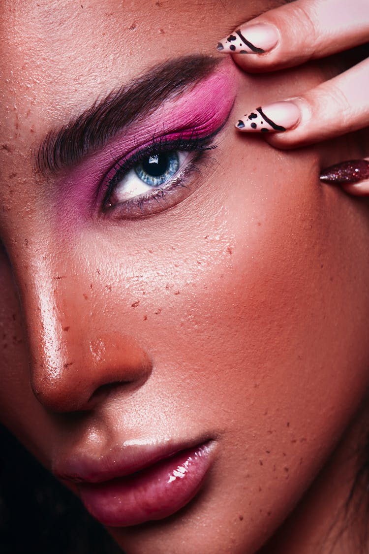 Close-up Of Woman Wearing Creative Makeup 