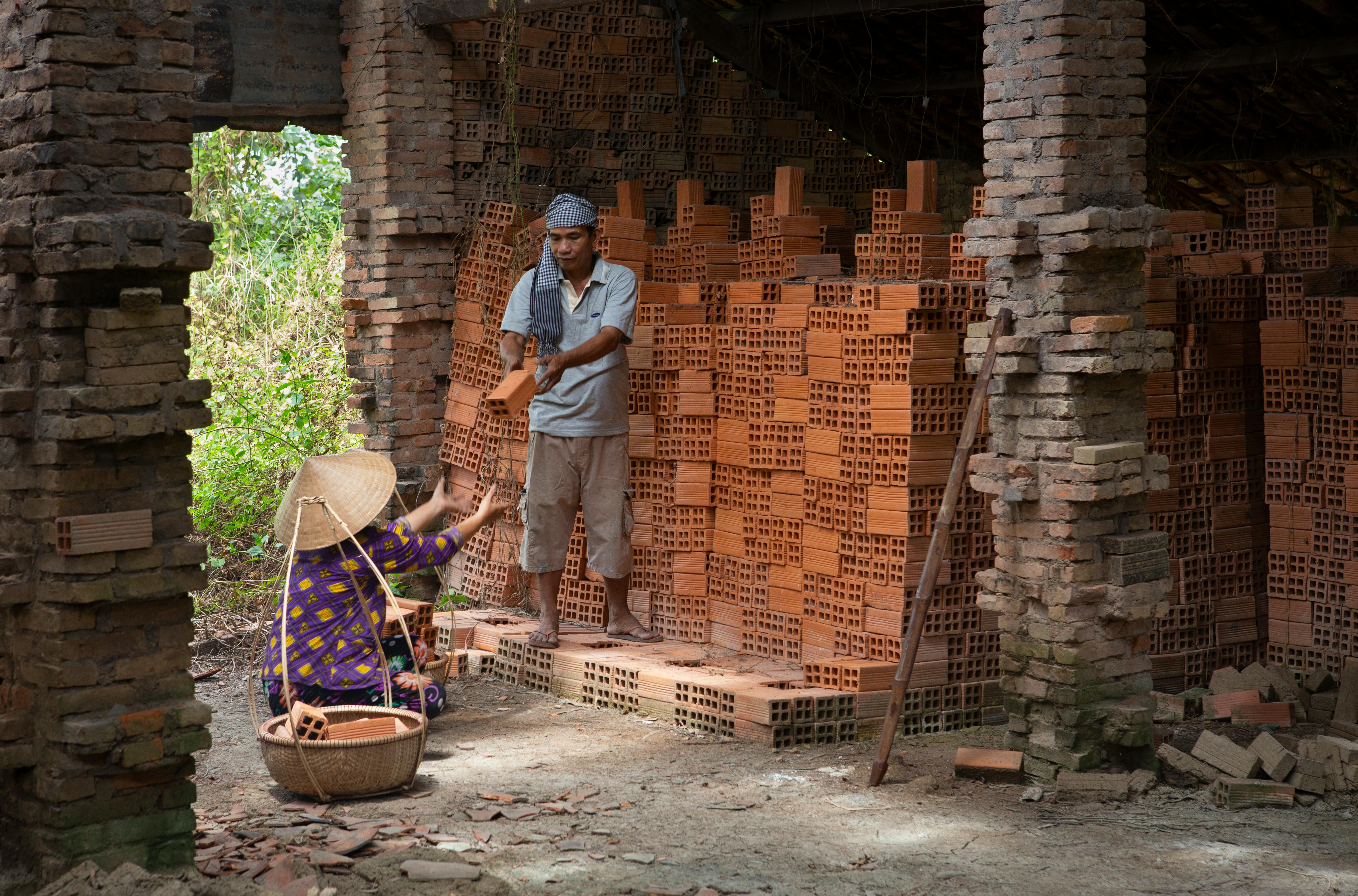 Men Selling Bricks · Free Stock Photo