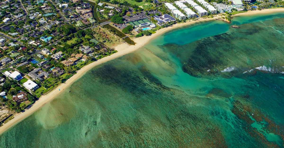 Photo by Cyrill Stunning aerial view of Waikiki Beach, urban scenery, and turquoise waters.