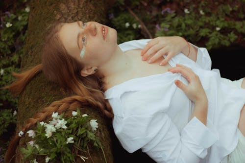 Redhead Model Posing in White Blouse