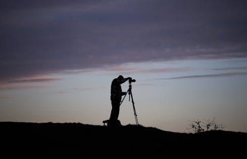 Free Silhouette of Photographer with Tripod Stock Photo