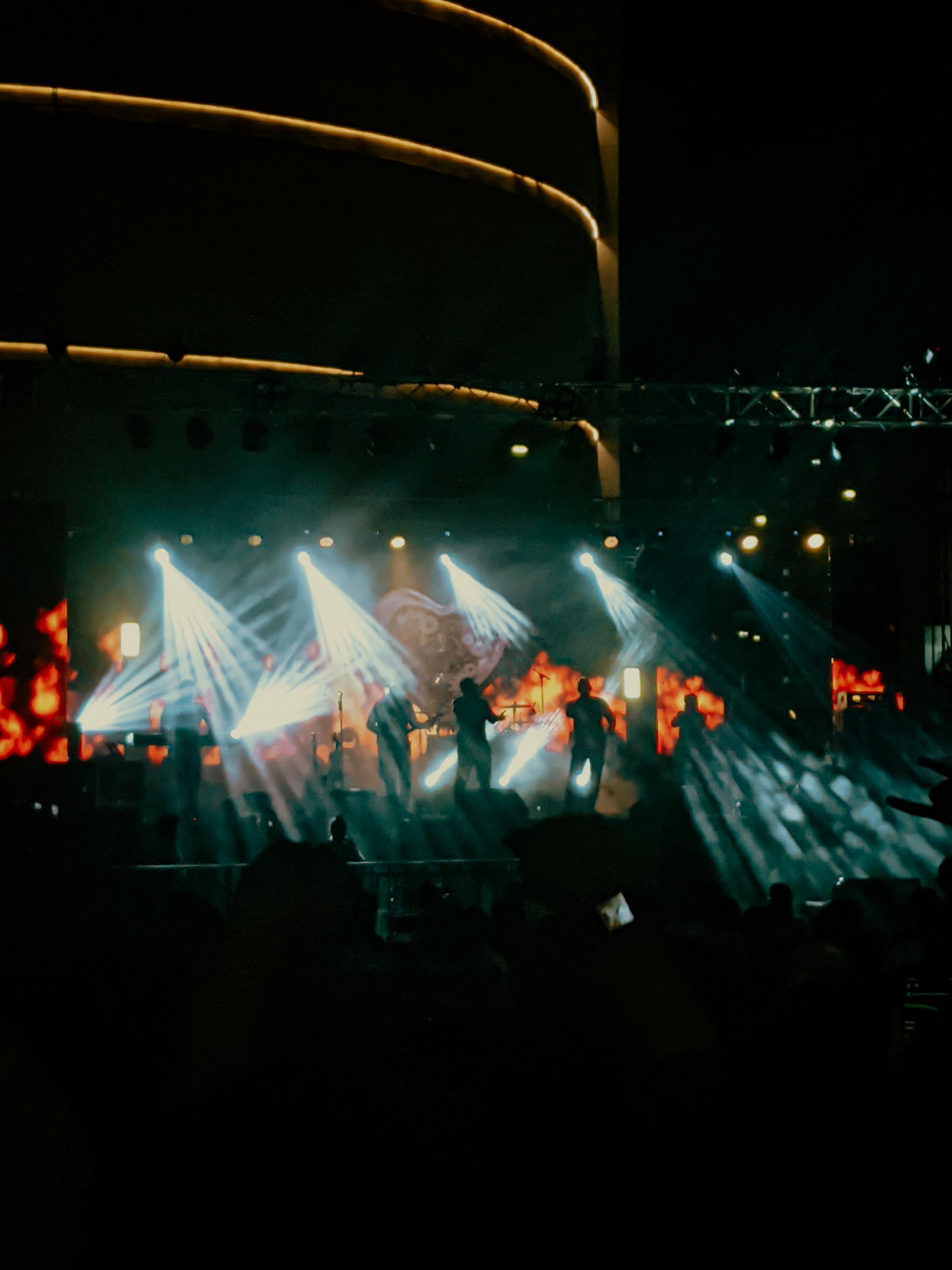 Concert lights over a band performing on stage