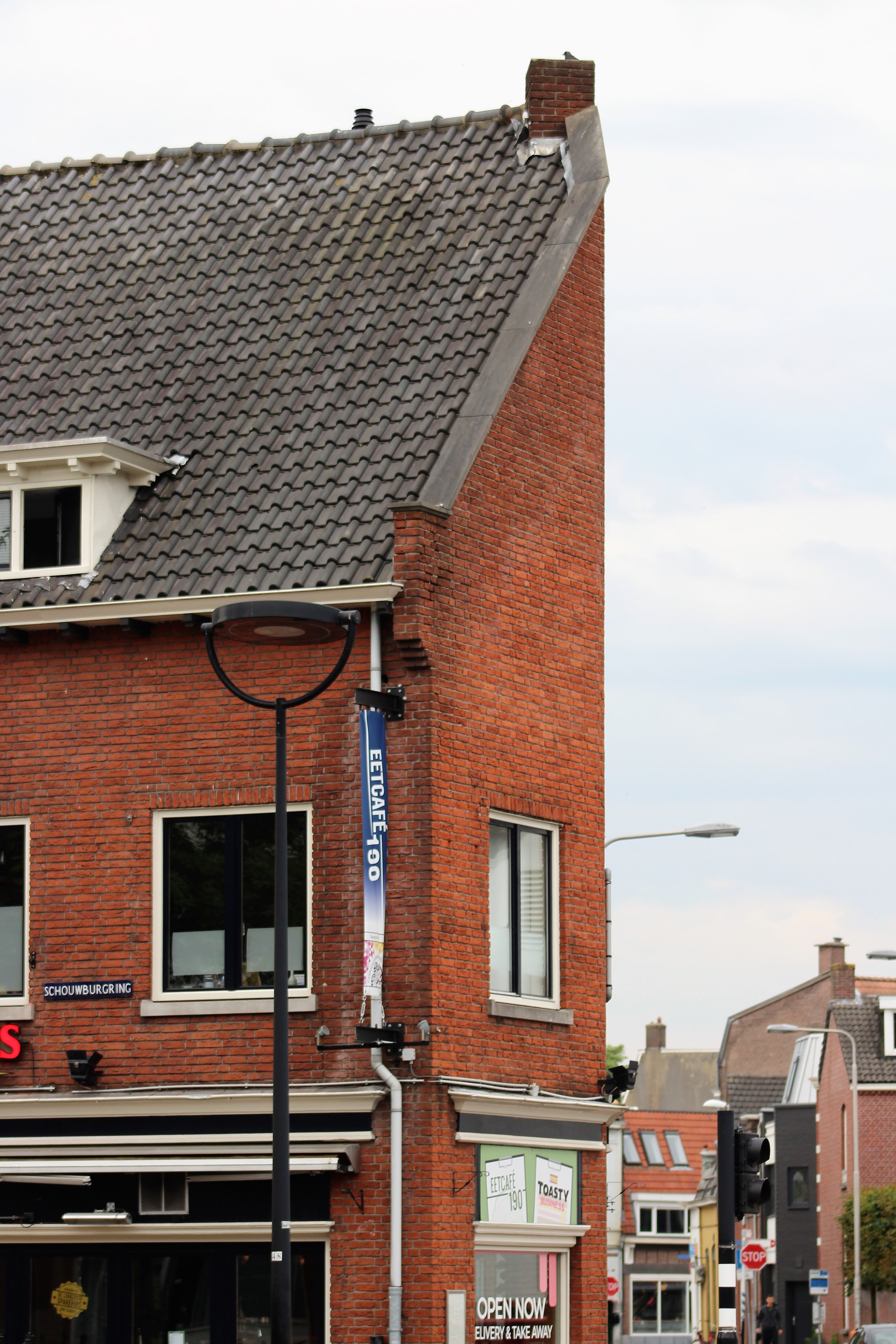 Red Brick House on Street Corner · Free Stock Photo