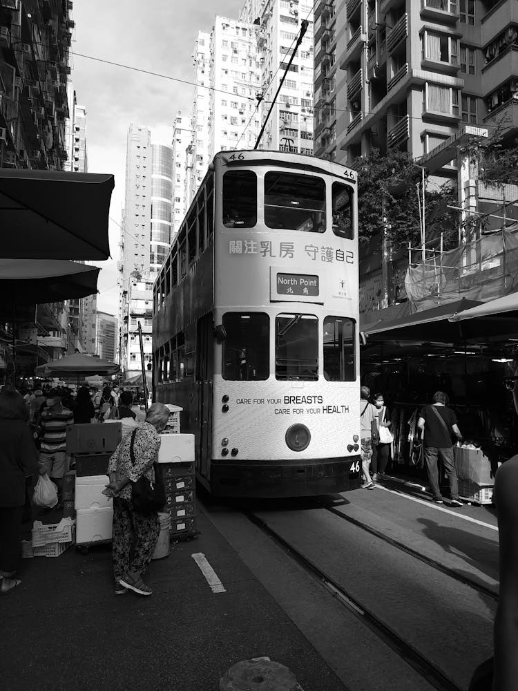 Cable Car With Health Slogan On Narrow City Street