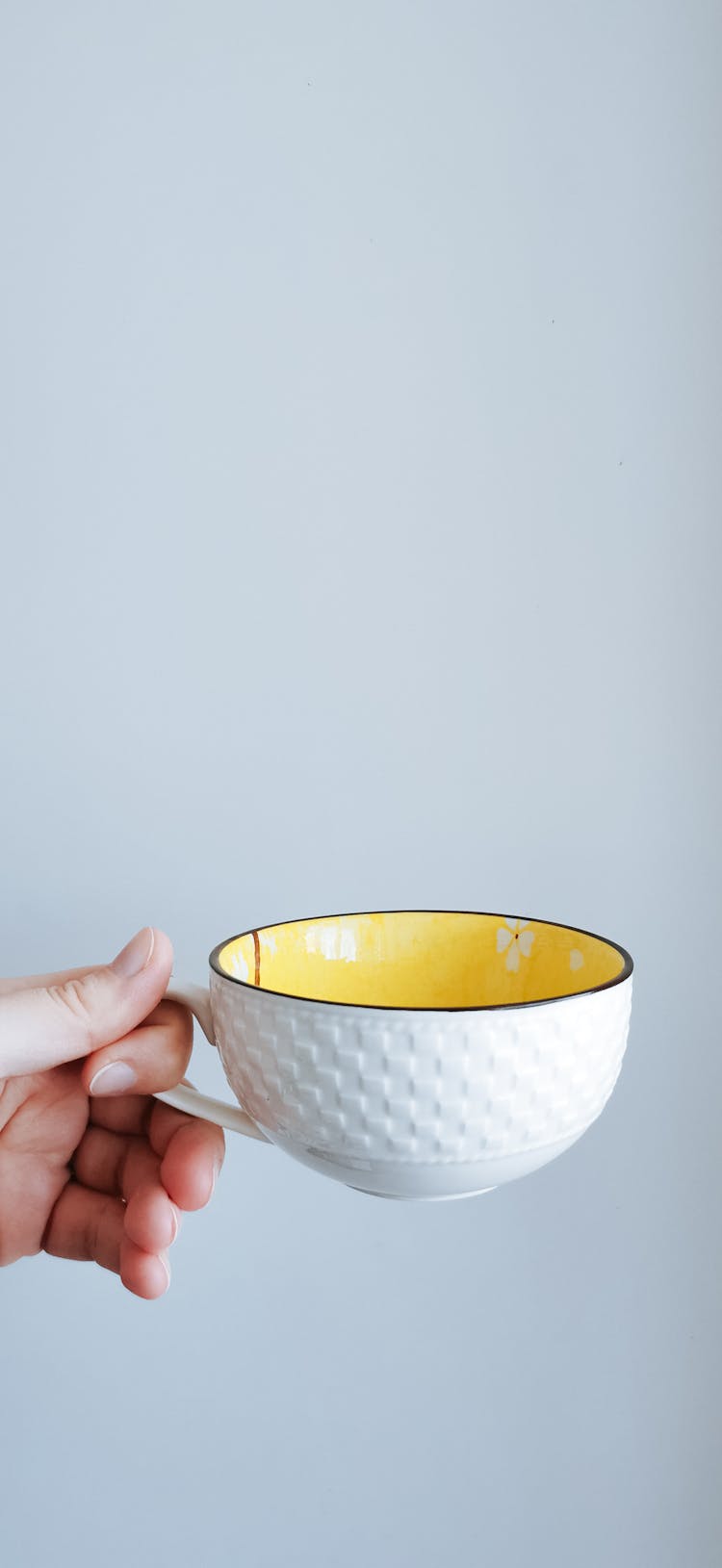 Woman Holding A Large Teacup 