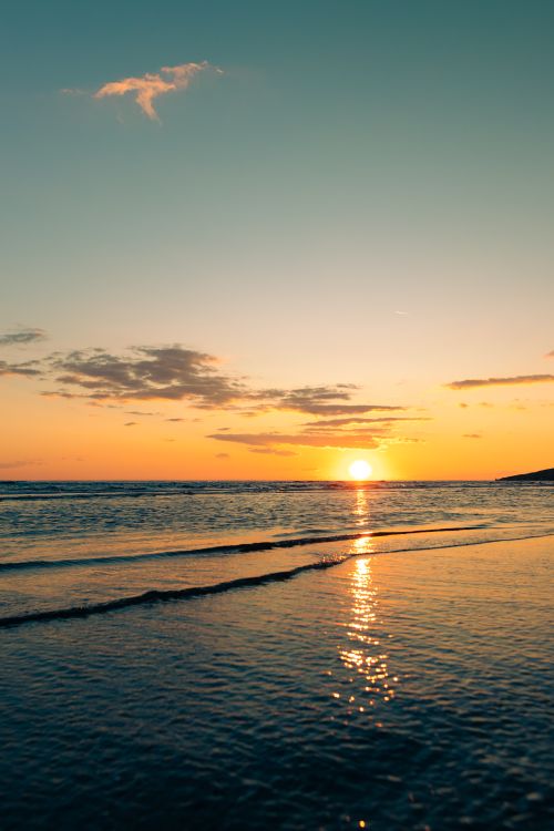 Free Captivating sunset over Ulcinj beach, Montenegro, with waves reflecting the warm sunset hues. Stock Photo