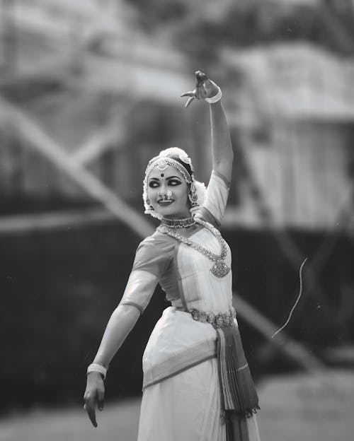 Young Woman Dancing in Traditional Clothing 