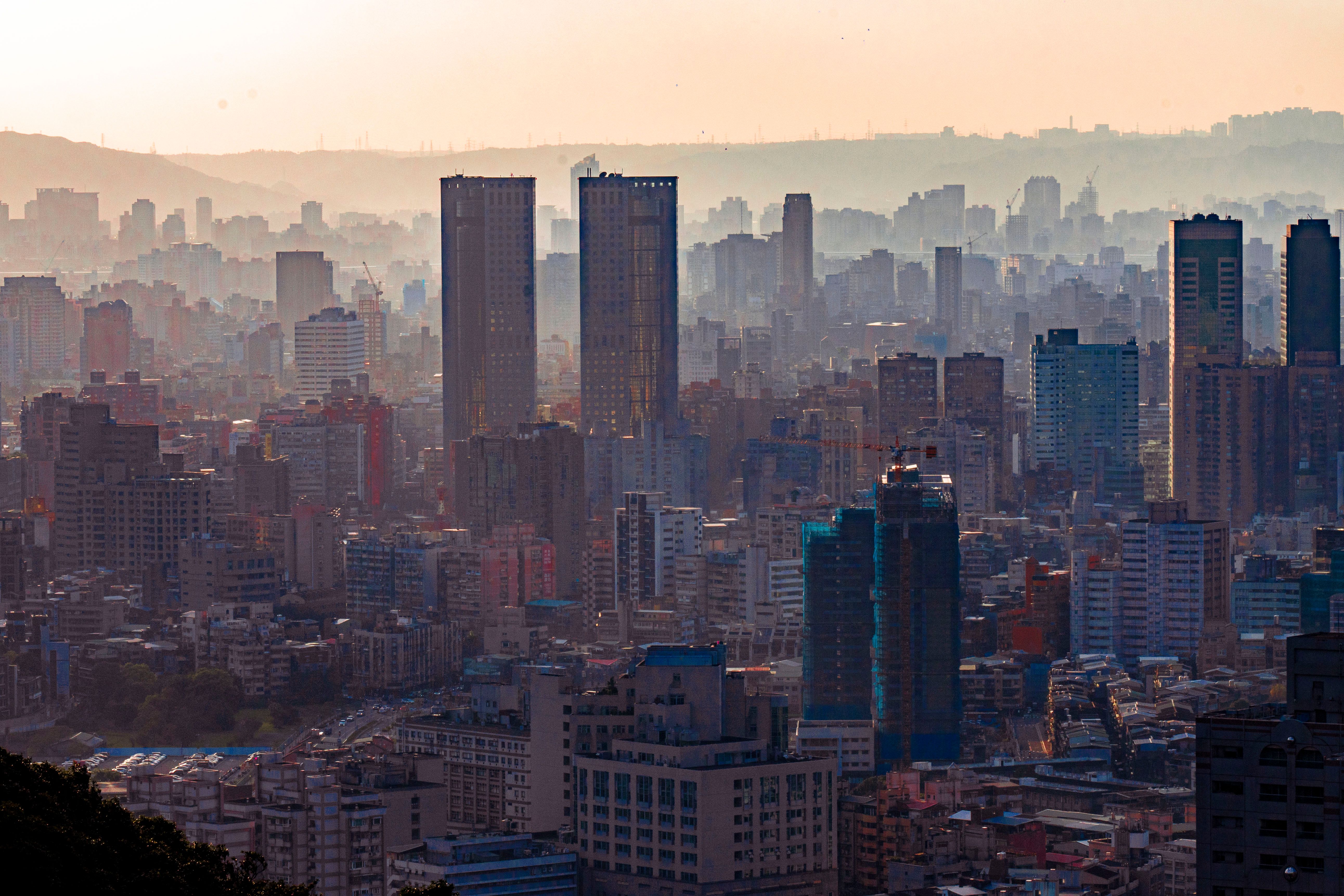 Captivating view of an urban skyline enveloped in morning mist, embodying tranquility.