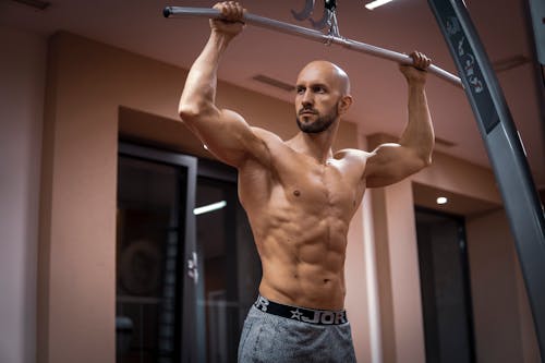 Muscular Bald Man at Gym