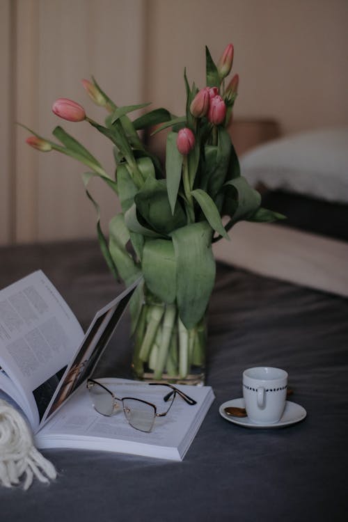 A Book, a Cup and a Bunch of Pink Tulips 