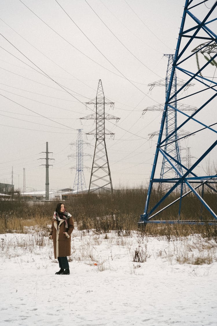 Young Woman On A Field In Winter 