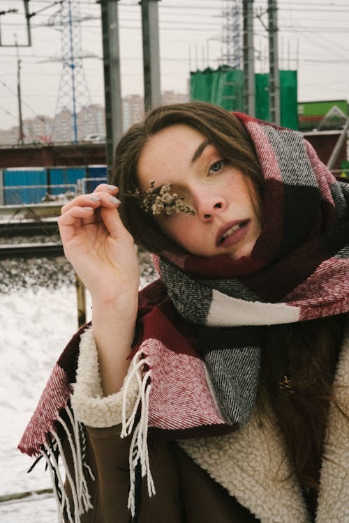 Young Brunette Wearing a Scarf Outdoors in Winter