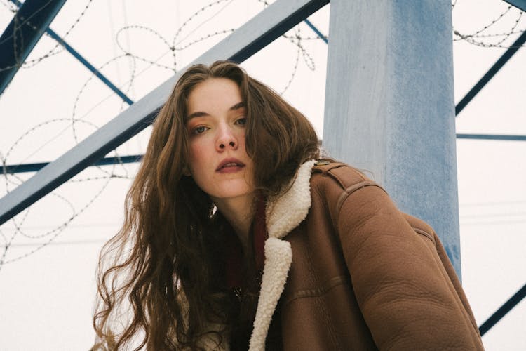 Low Angle Shot Of Woman Wearing Jacket