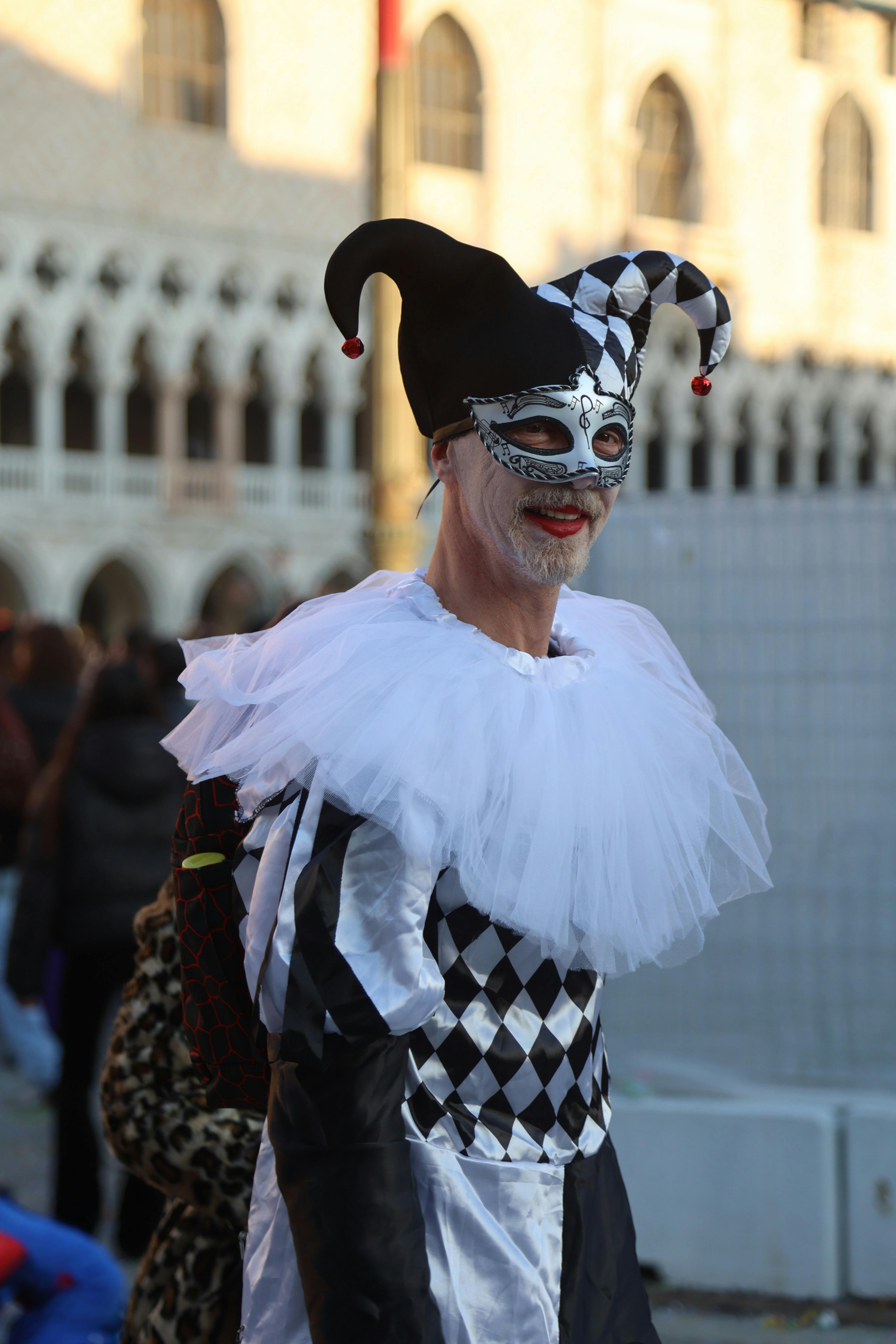 A man dressed as a jester in venice · Free Stock Photo