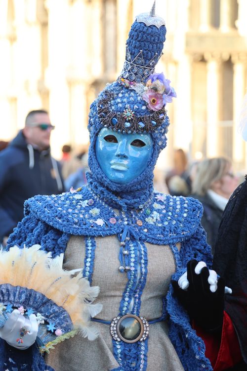 Free Capture the mystery and elegance of the Venetian Carnival with this beautifully detailed blue mask and costume. Stock Photo
