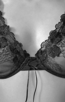 Detailed black lace lingerie fashion photograph exuding elegance and sensuality.