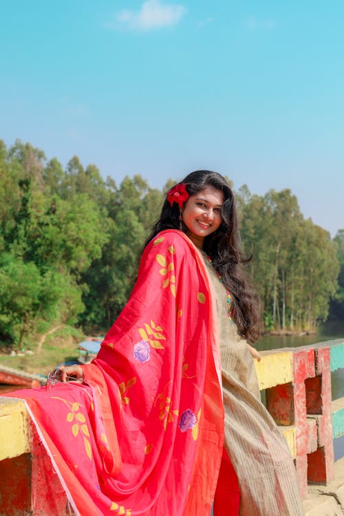 Smiling Woman in Colorful Clothes