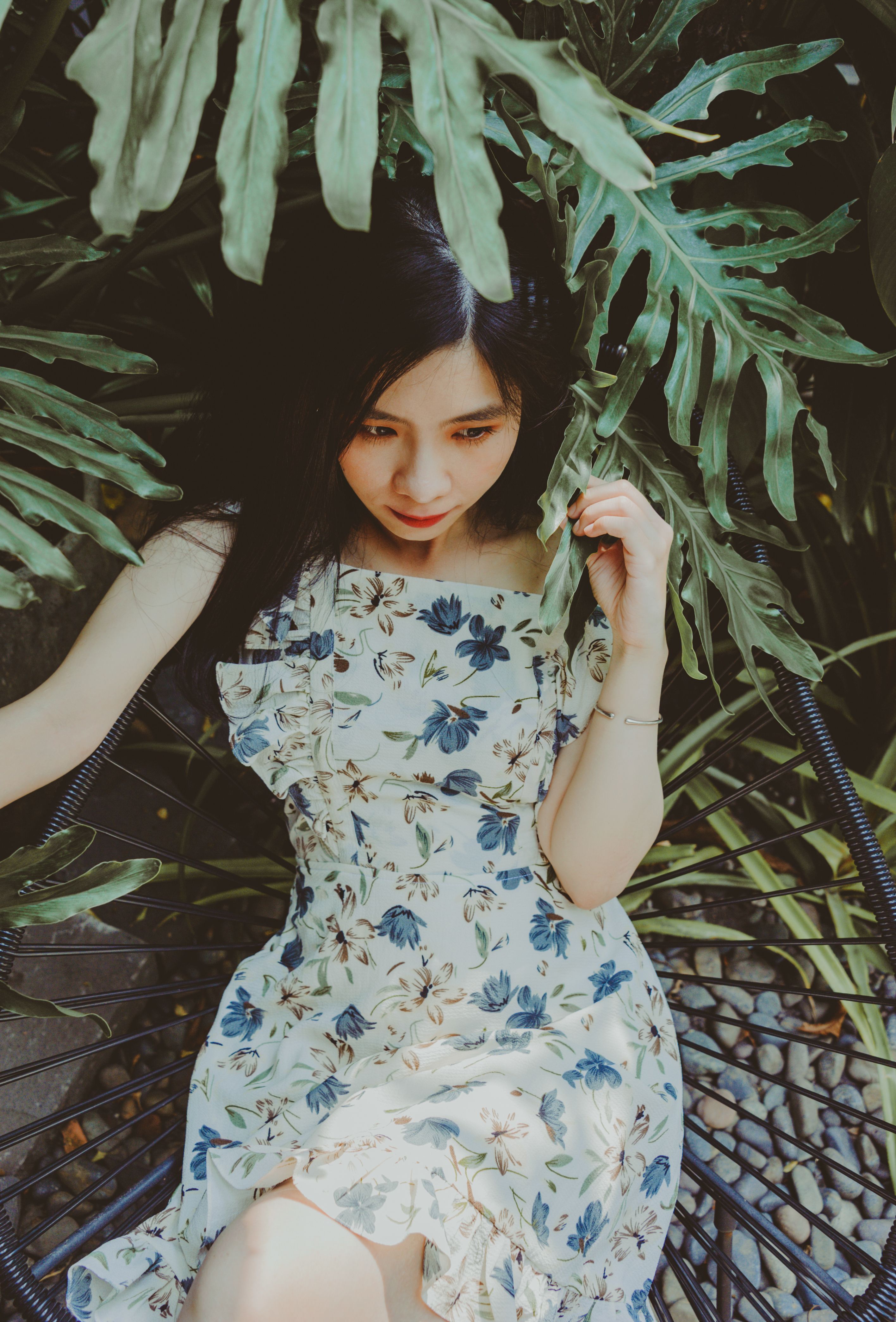 Woman in White and Blue Floral Sleeveless Dress · Free Stock Photo
