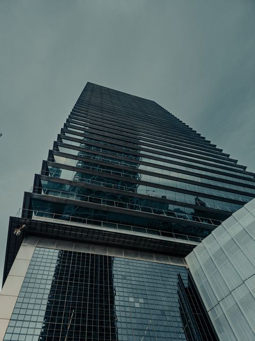 Free Low angle shot of a glass skyscraper in Barcelona's urban financial district. Stock Photo