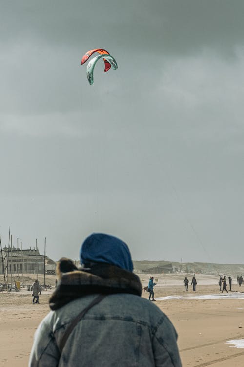 A Man Watching Parachutes