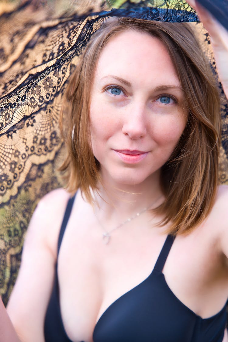 Portrait Of A Pretty Brunette Holding A Shawl