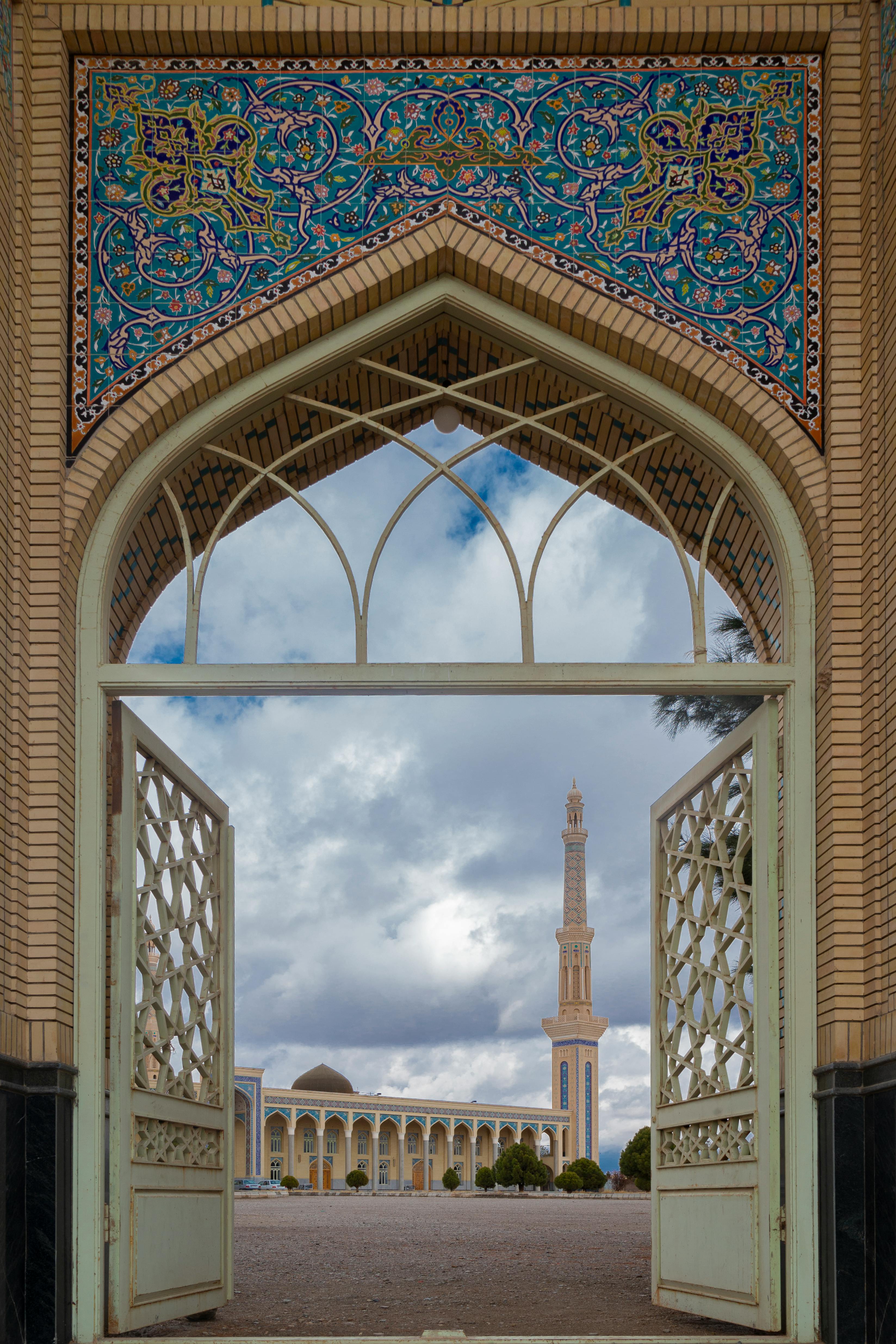 Intricate archway frames the splendid architecture of a mosque in Khaf, Iran.