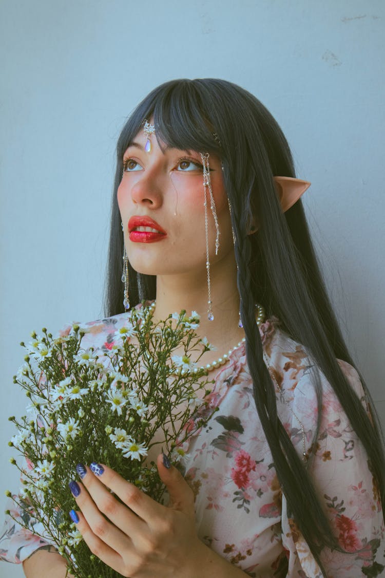 Woman With Elf Ears Posing With Flowers