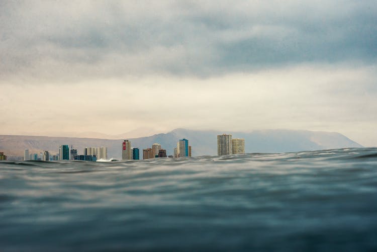 City Buildings Behind Blue Wave