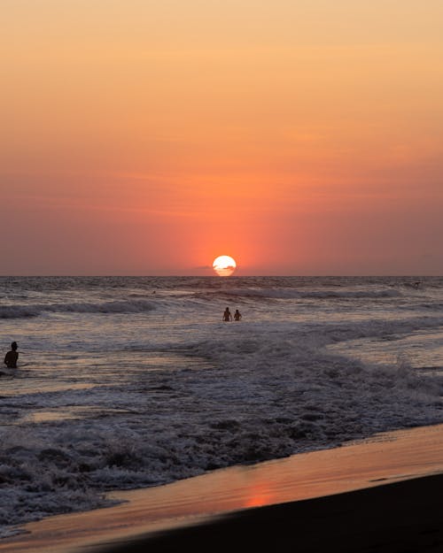 Sunset on Clear Sky over Sea Shore