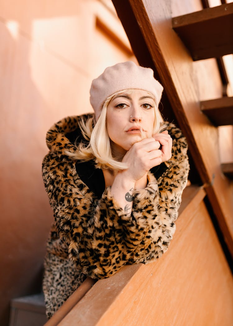 Blonde Woman Leaning On Wall