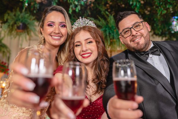 Elegantly dressed friends toasting at an evening party — Juliano Astc on Pexels