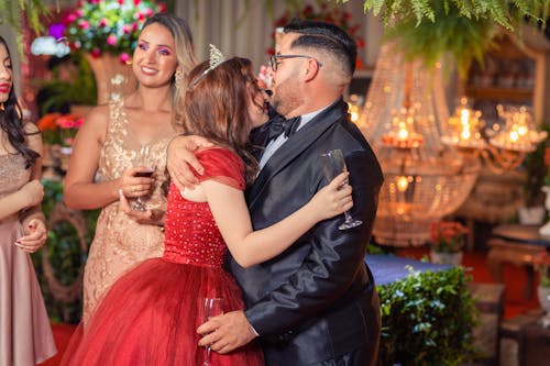 People in Elegant Clothes Hugging on a Party 