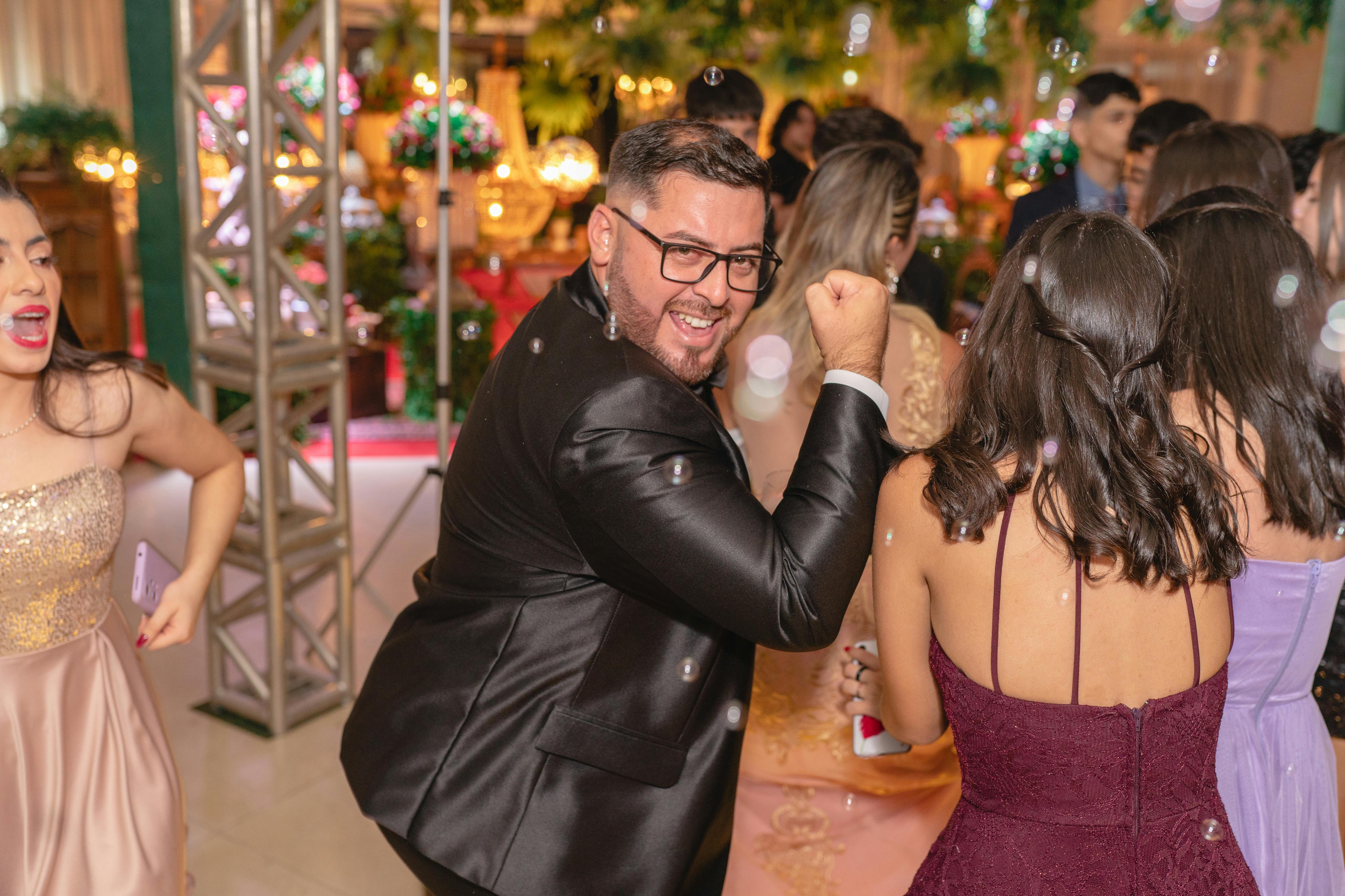 Photo by Juliano Astc from Pexels: Dancing Man in Suit