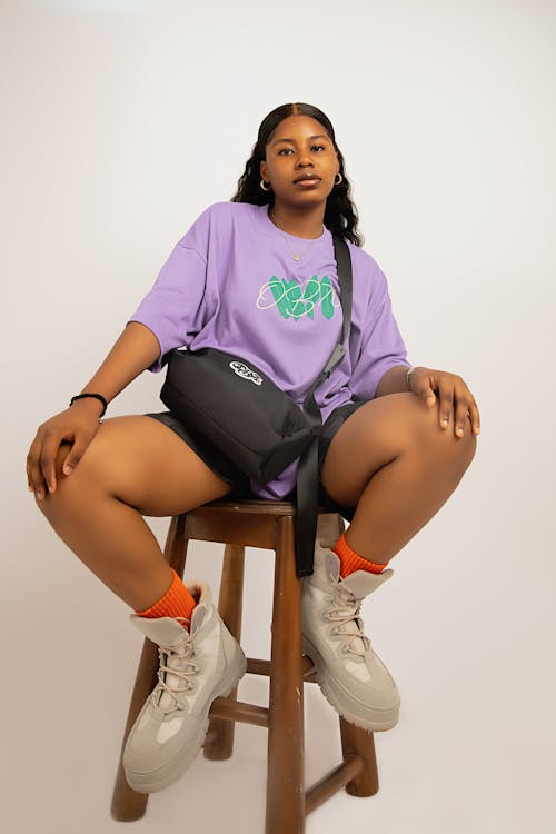 Young Woman in Trendy Clothes Posing in Studio 