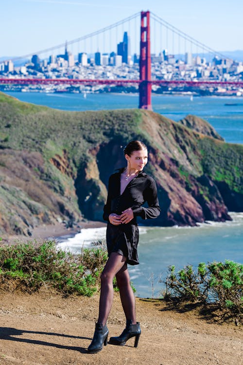 Model in a Black V-neck Mini Dress and Stockings with the Golden Gate Bridge in the Background