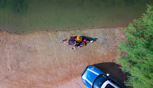 Aerial Photo of Women Lying on Ground