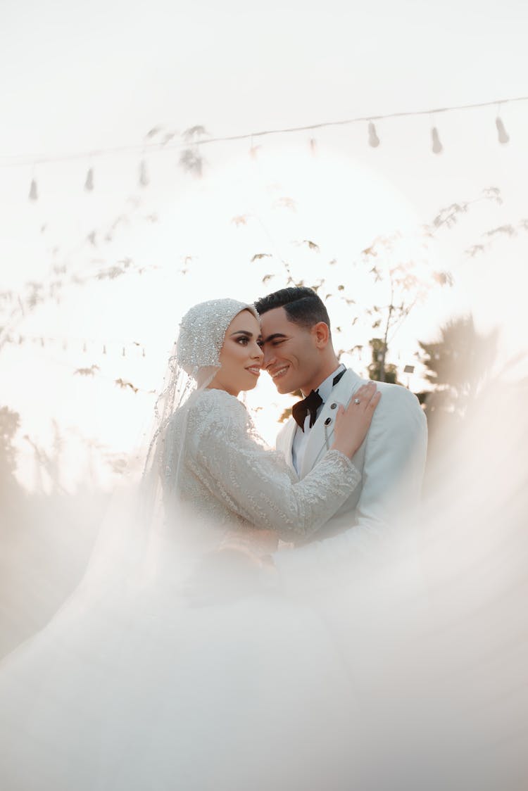 Happy Bride And Groom Dancing At Wedding