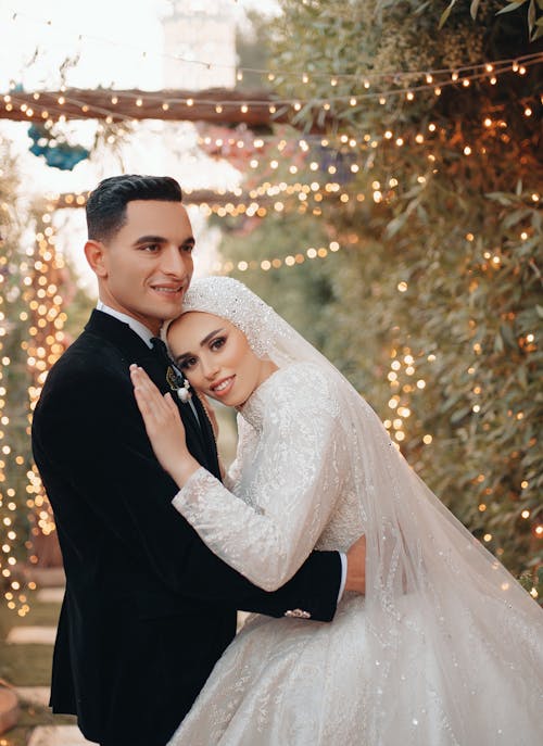 Bride and Groom Hugging at Wedding in Garden 