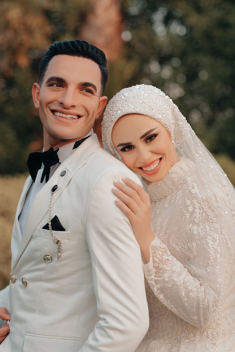 Portrait Of Happy Bride And Groom Hugging