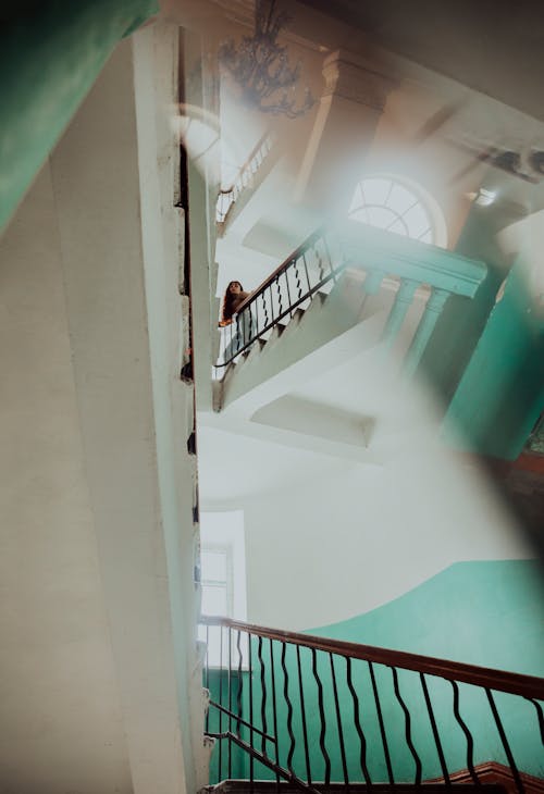 Woman Climbing the Stairs in the Stairwell