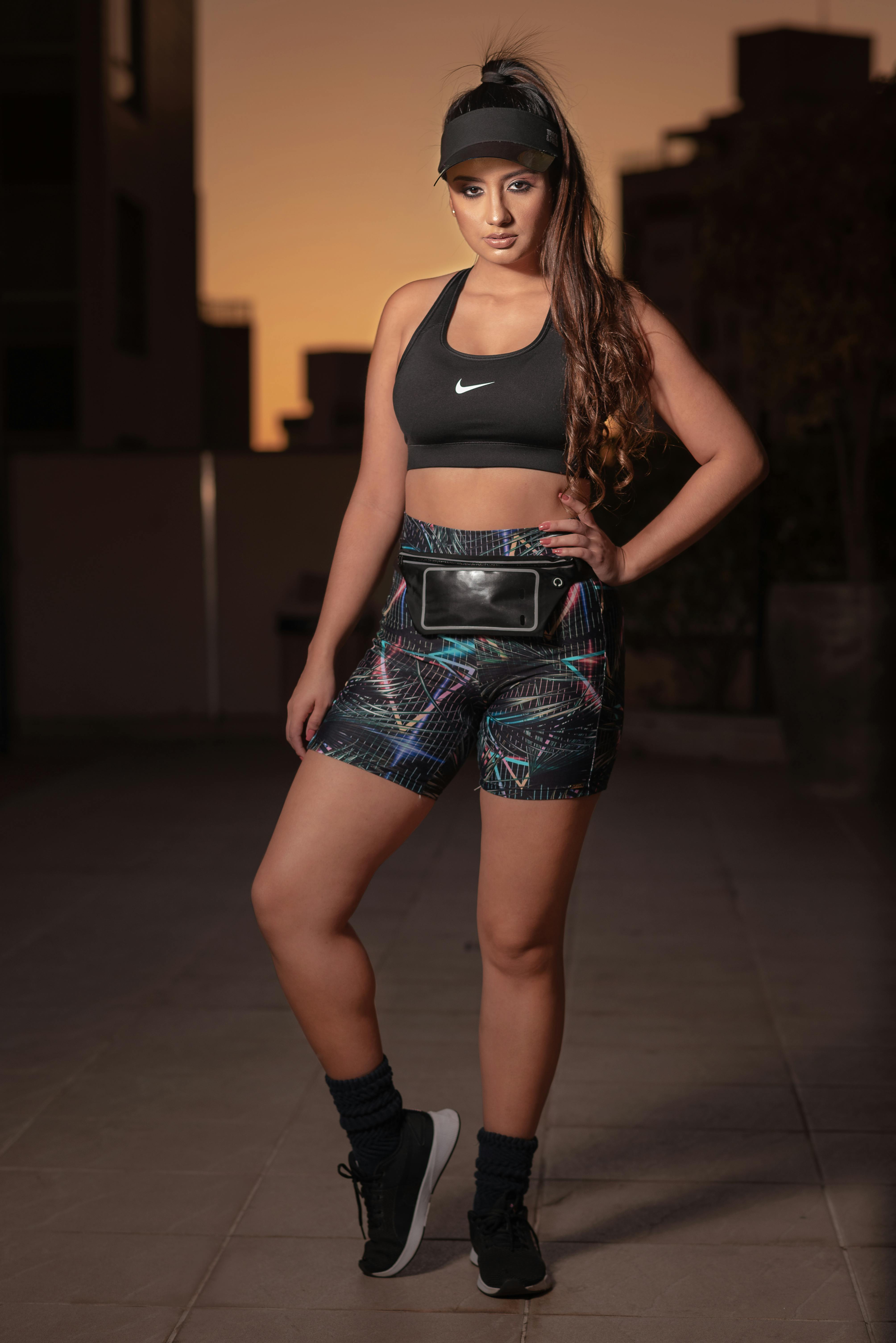 Model in a Black Nike Sports Bra and Short Leggings Posing on the