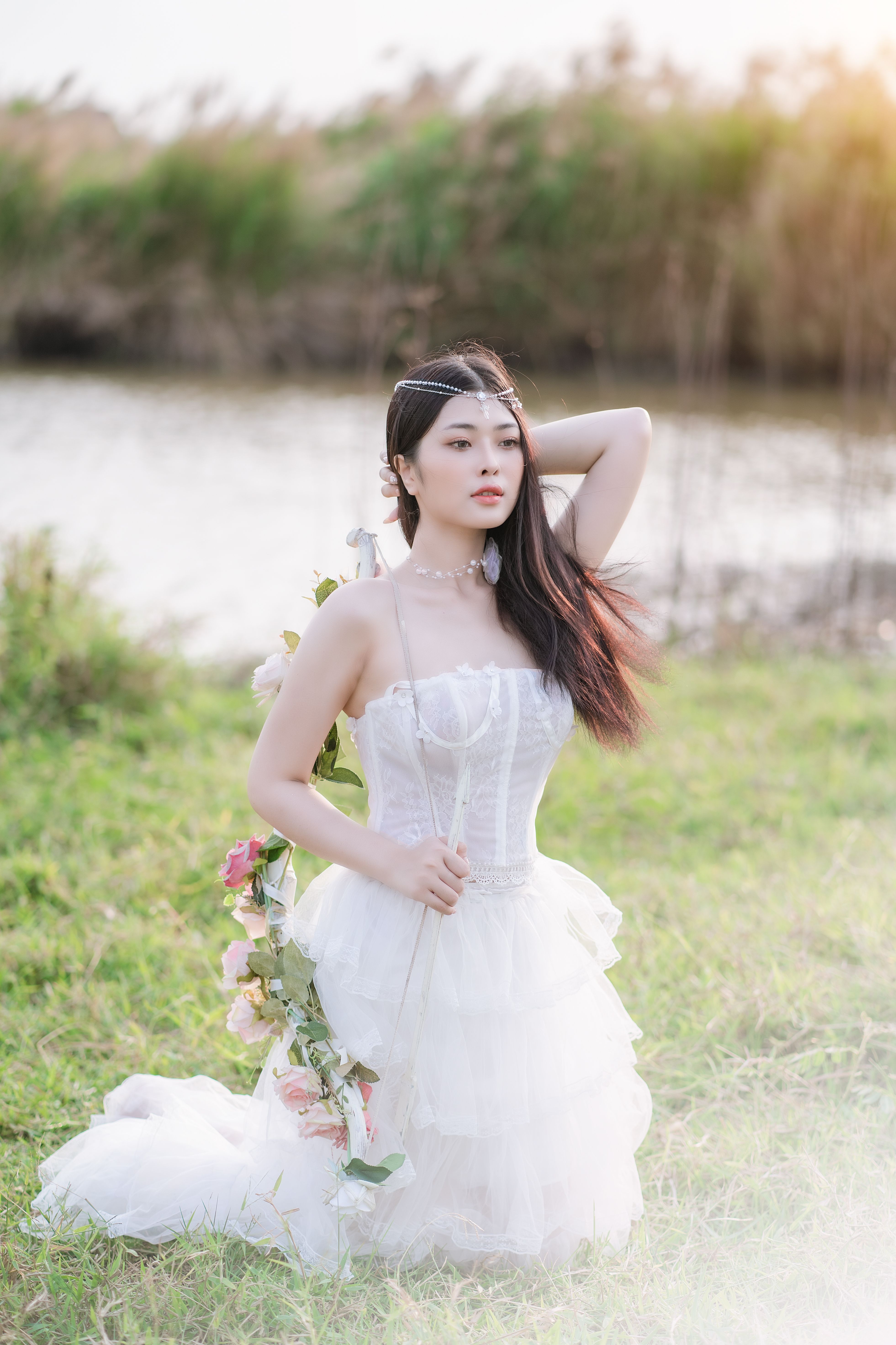 Woman in White Dress Kneeling on Grass · Free Stock Photo