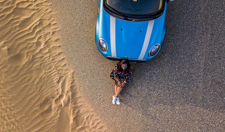 Woman Leaning On Car