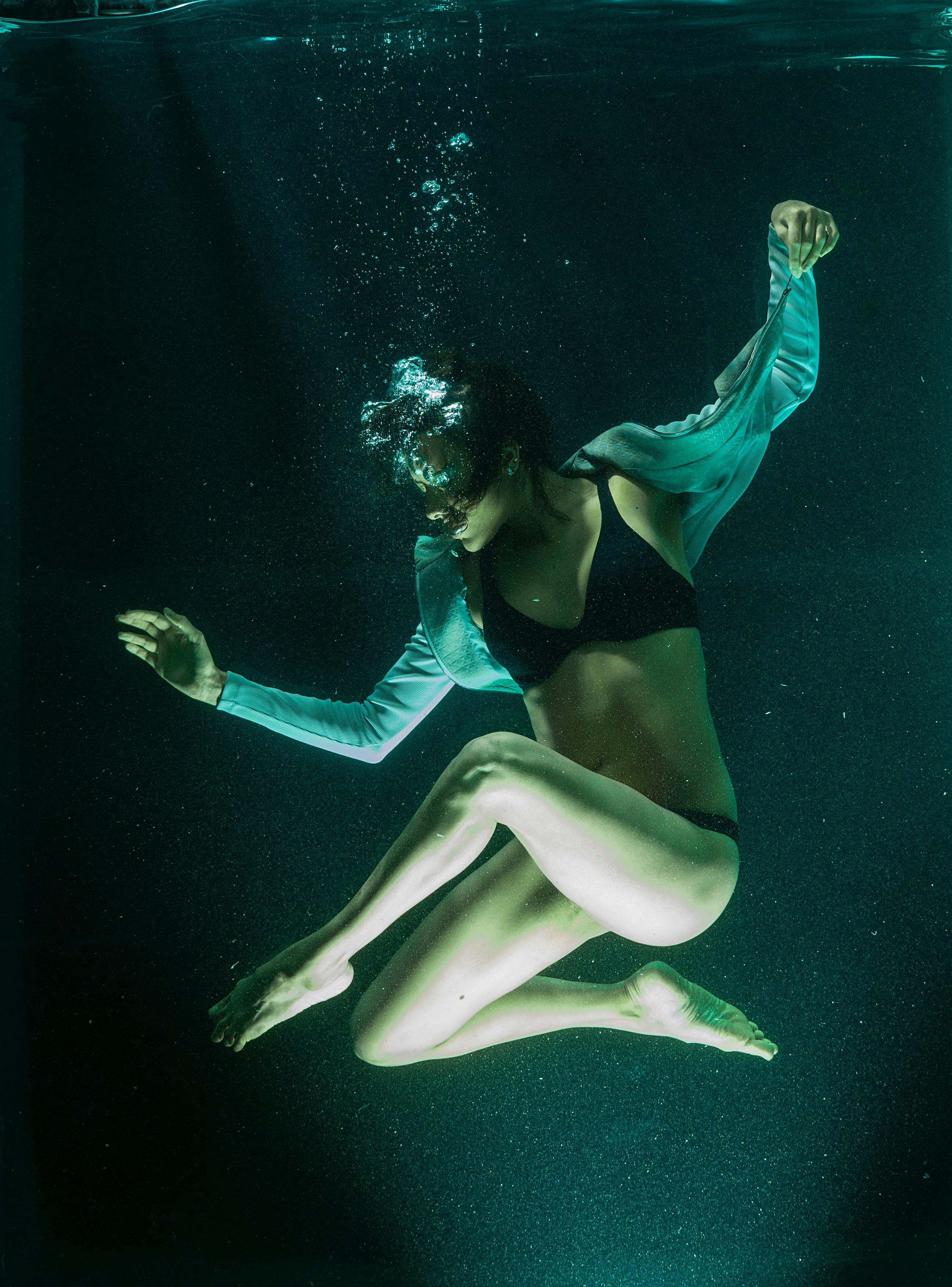 underwater photography of woman