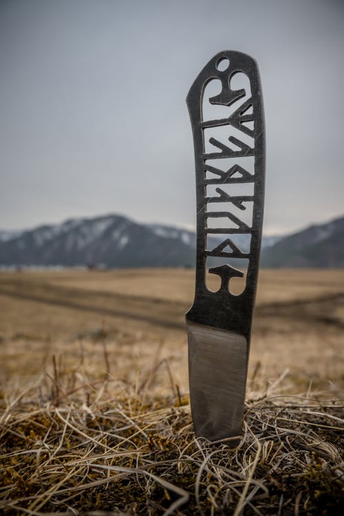 Knife made of One Piece of Steel with Runes Carved into the Handle